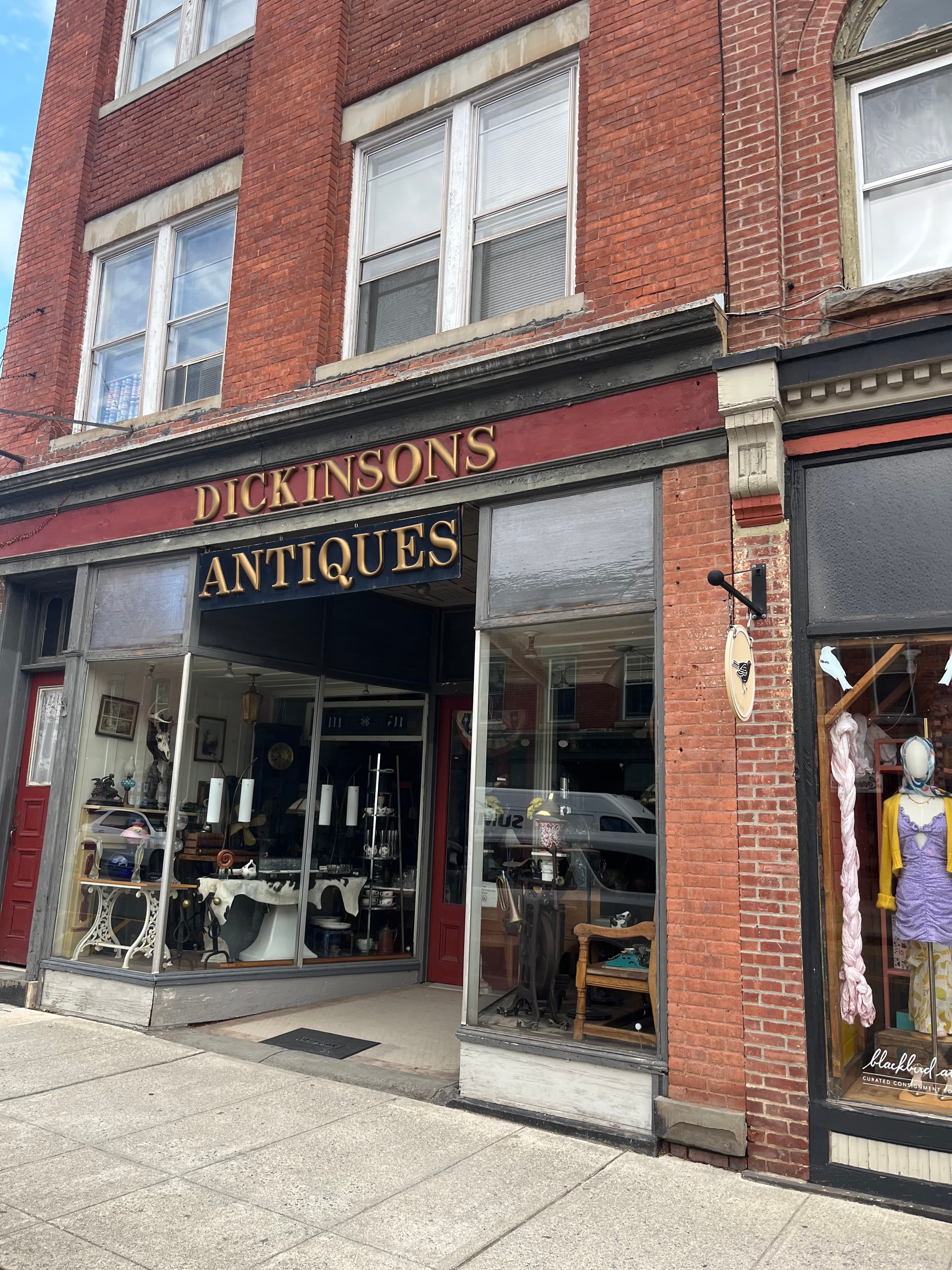 Front view of Dickinson's Antiques store, showcasing vintage items and displays.